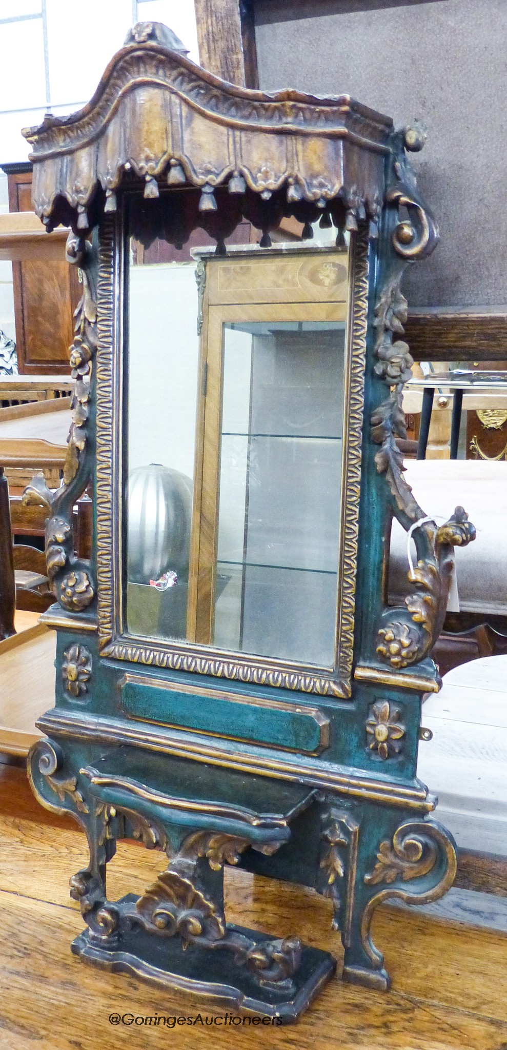 An Iberian green-painted and parcel-gilt rectangular wall mirror